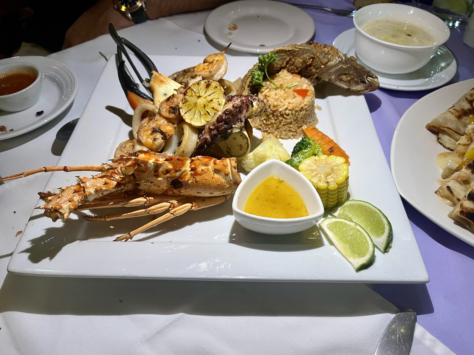 Grilled lobster, whole fish, shrimp, squid and octopus with rice and vegetables