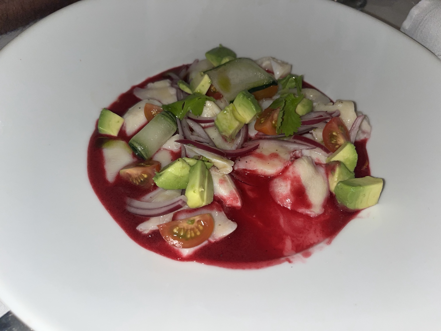 Seafood ceviche with avocado, cucumber, tomato, red onion and cilantro