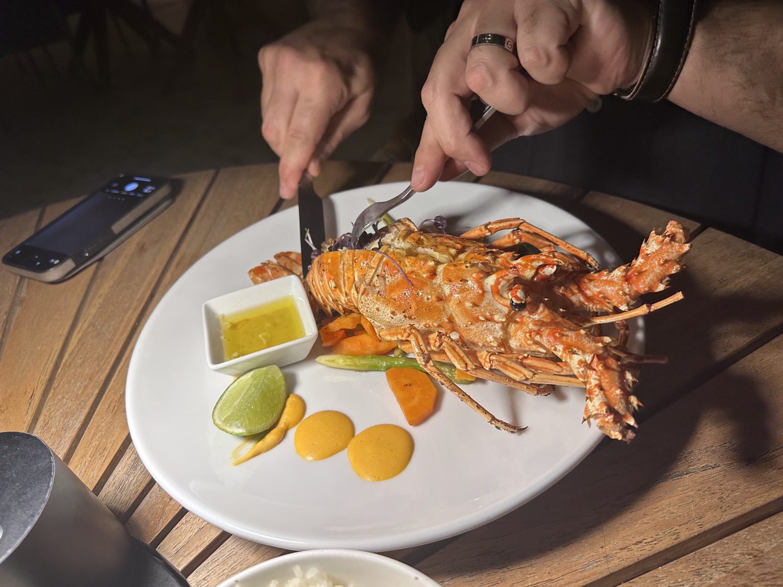 Whole split lobster with vegetables, lime, butter and golden sauce