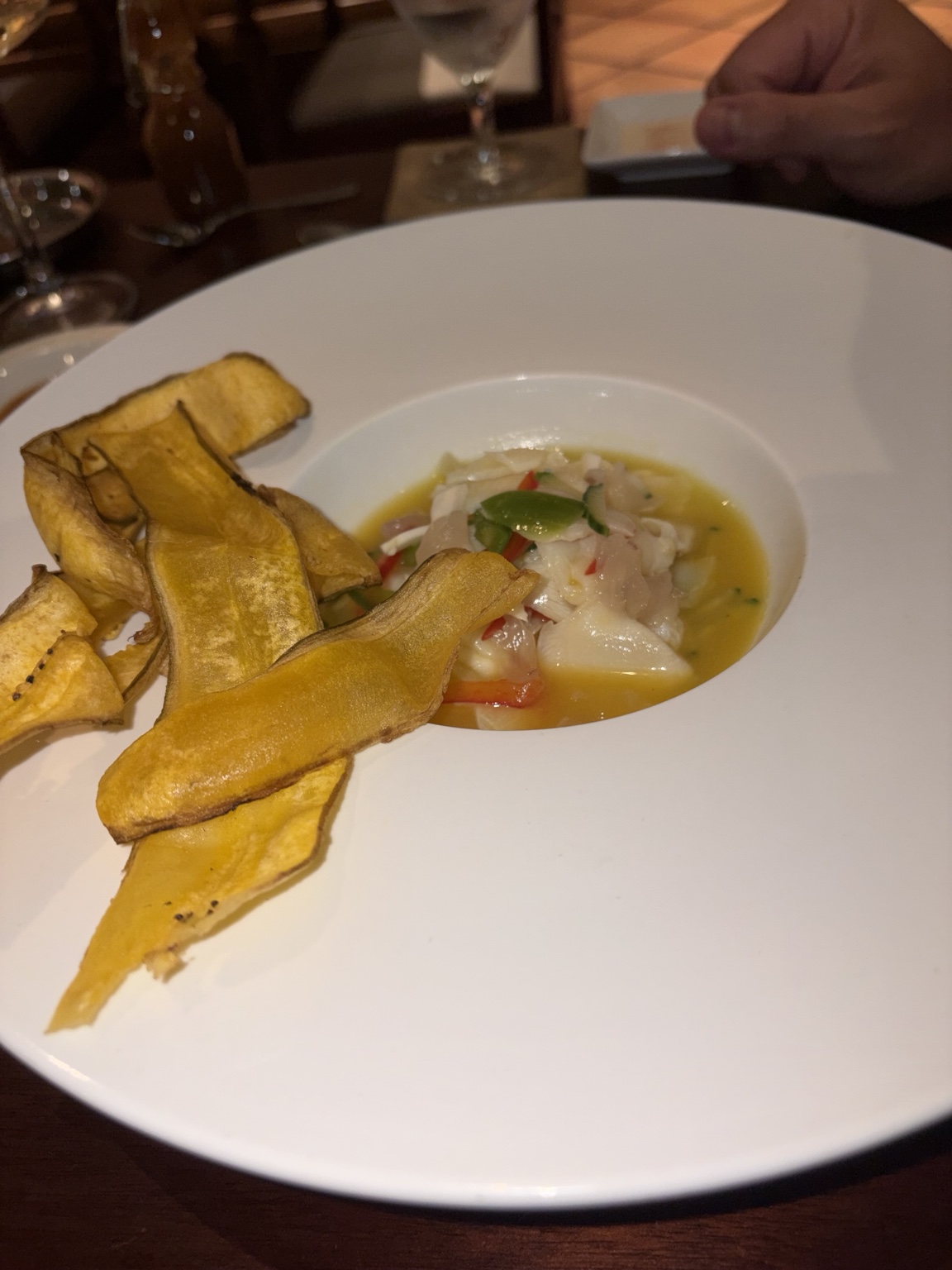 Seafood ceviche in citrus broth with crisp plantain chips