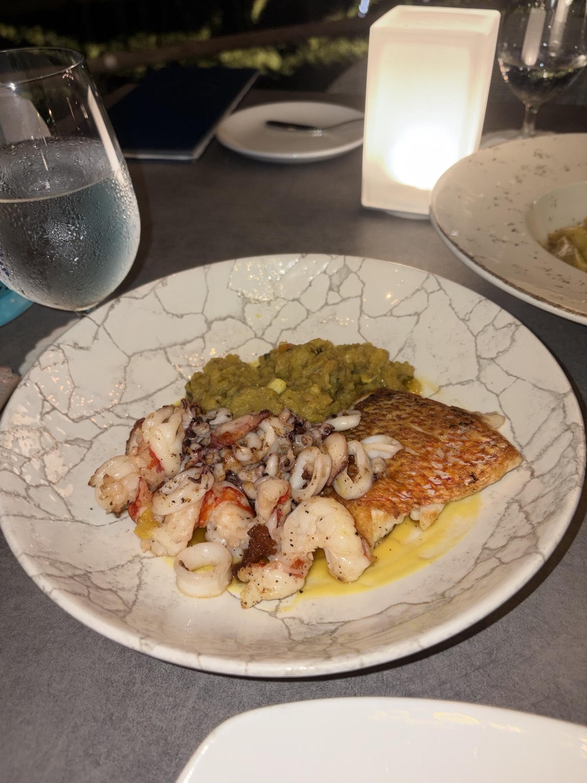 Crispy-skinned fish with shrimp, squid and vegetable mash