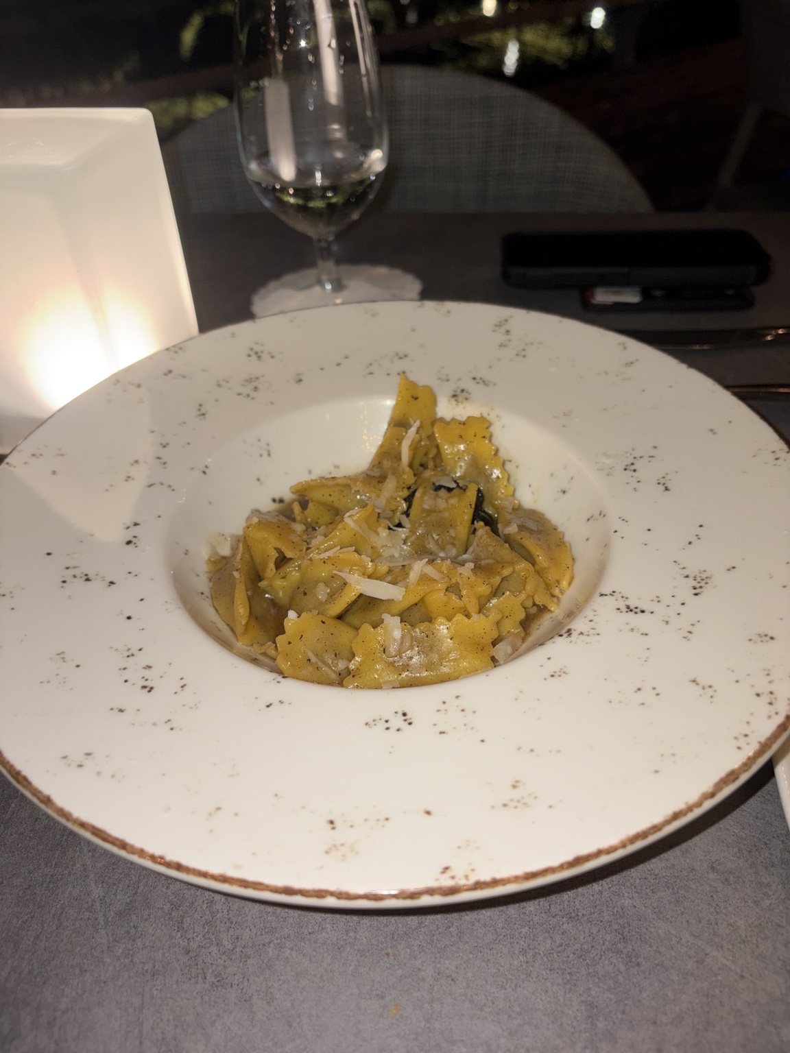Filled pasta in a glossy sauce with grated cheese