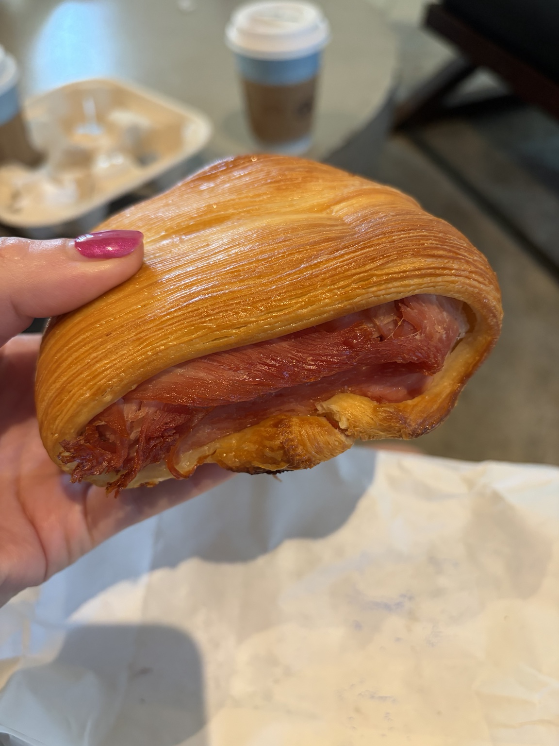 Golden laminated pastry filled with cured ham