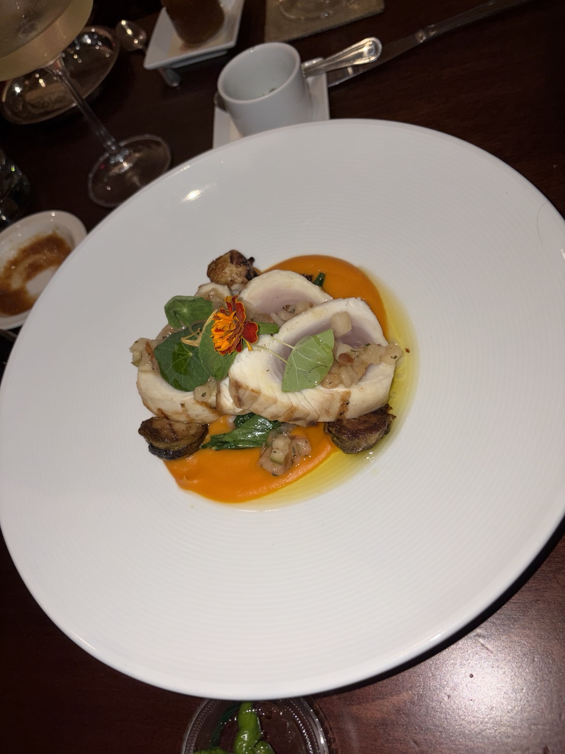 Sliced stuffed chicken with roasted vegetables and orange puree