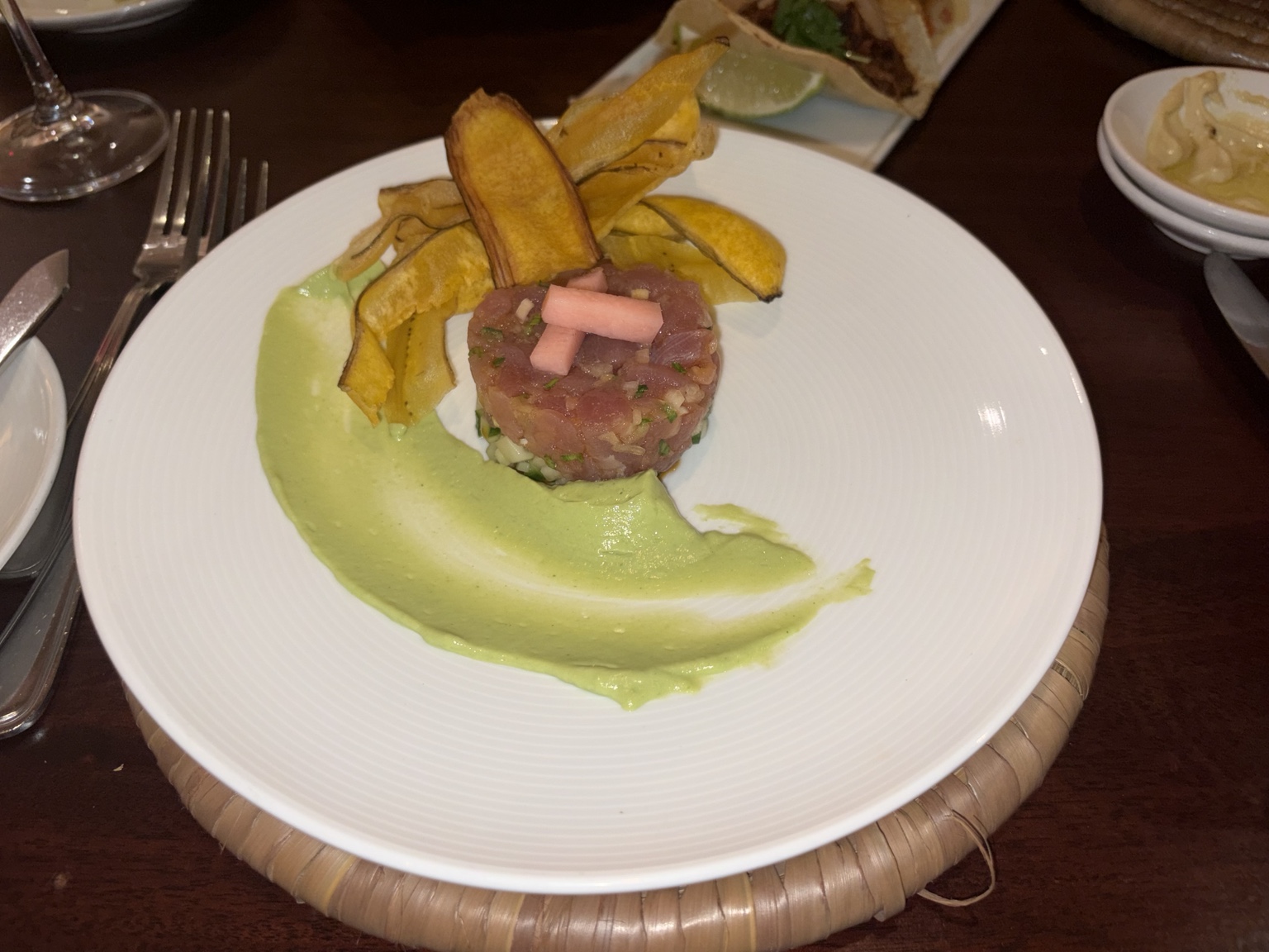 Tuna tartare with avocado cream, pickled garnish and plantain chips