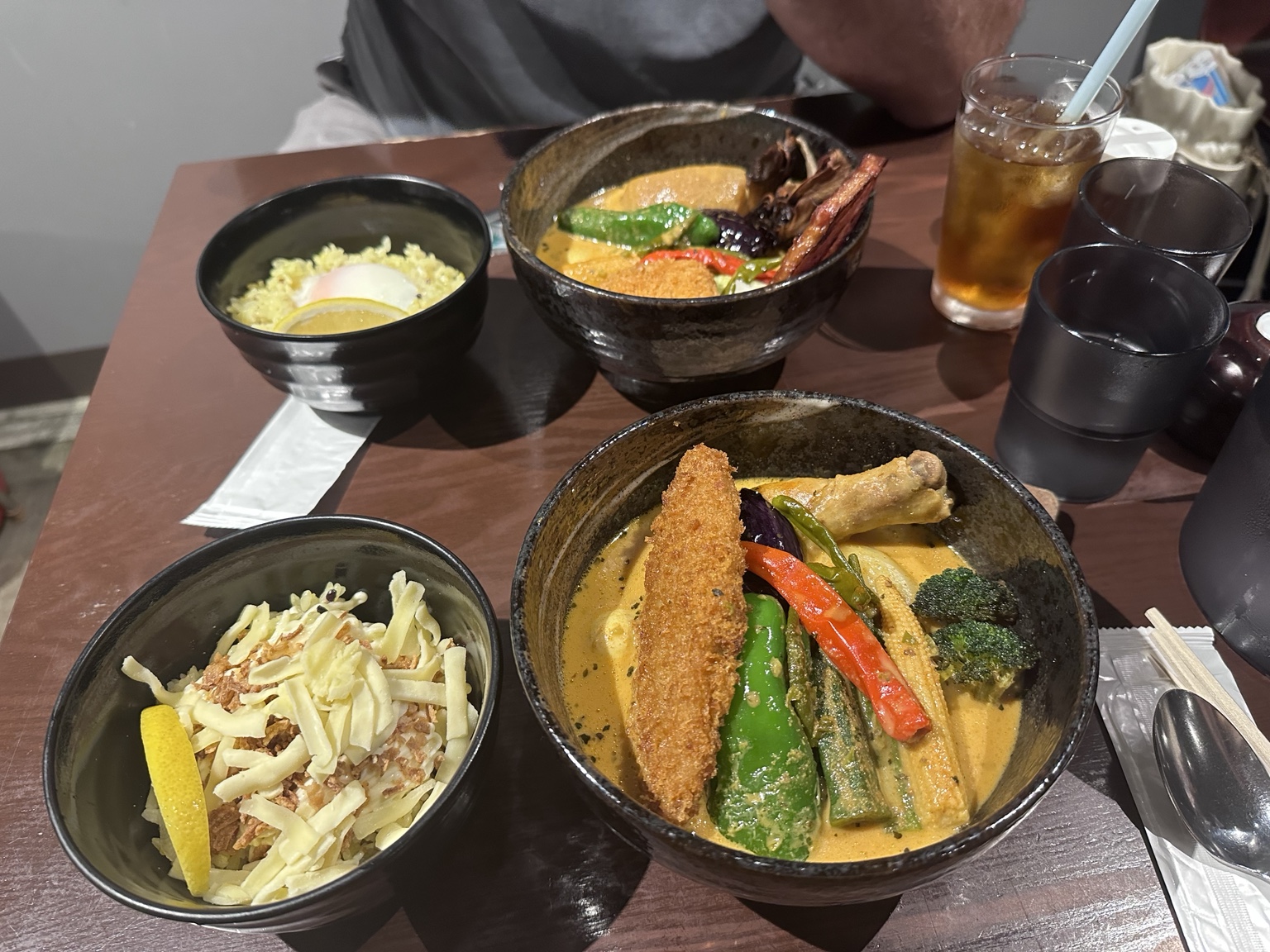 Two bowls of Japanese soup curry with vegetables and rice