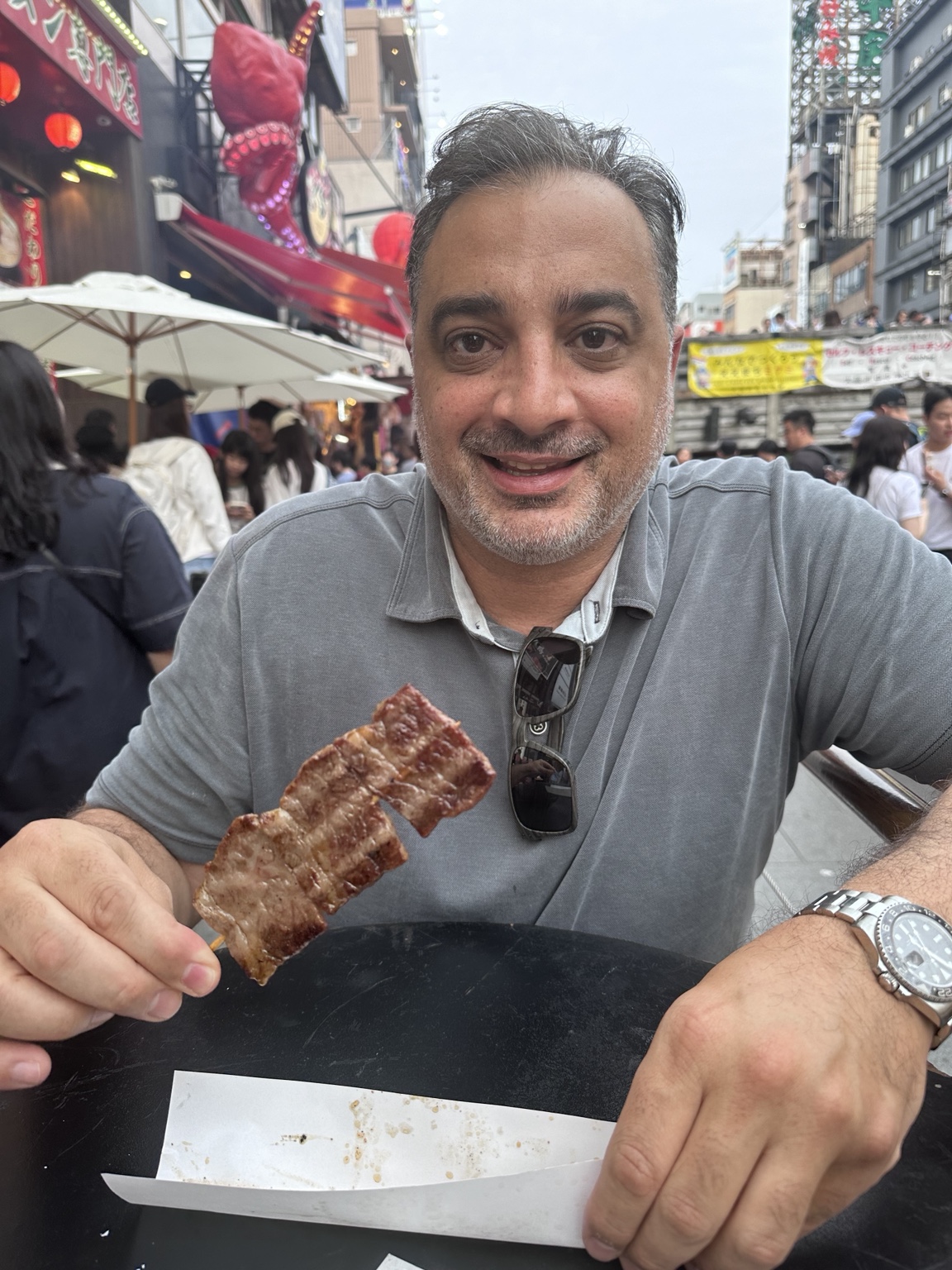 Grilled beef pieces served on a street-food skewer