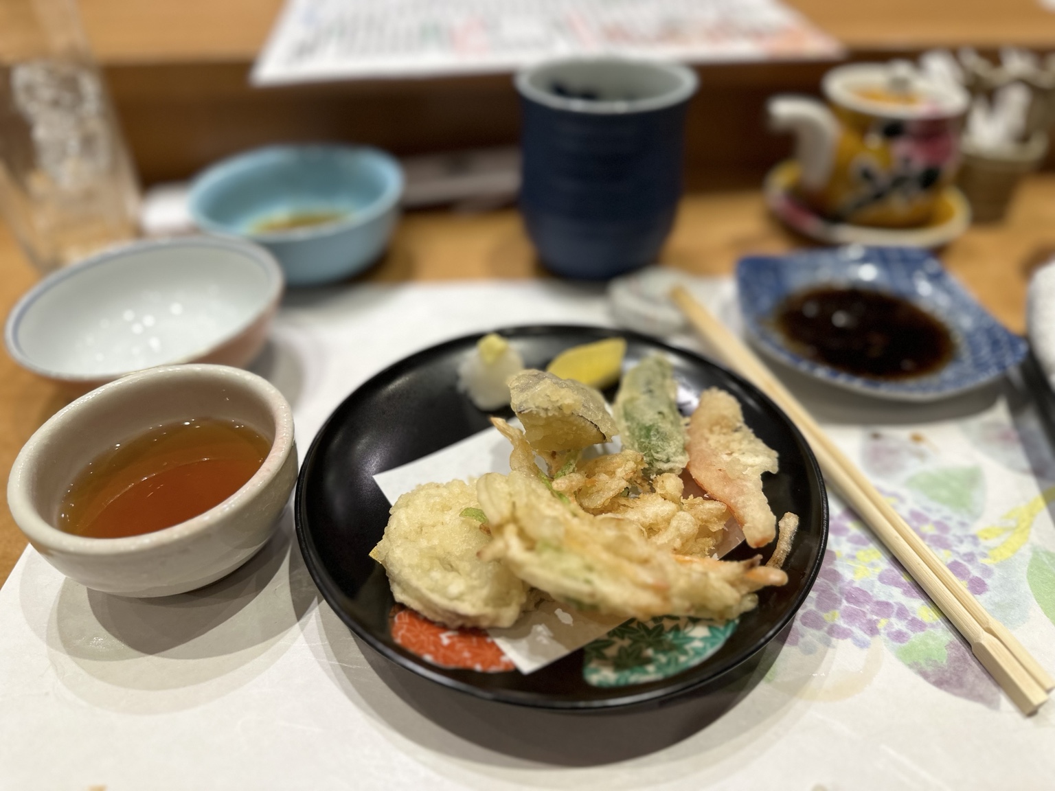 Assorted vegetable tempura with dipping sauce and grated daikon