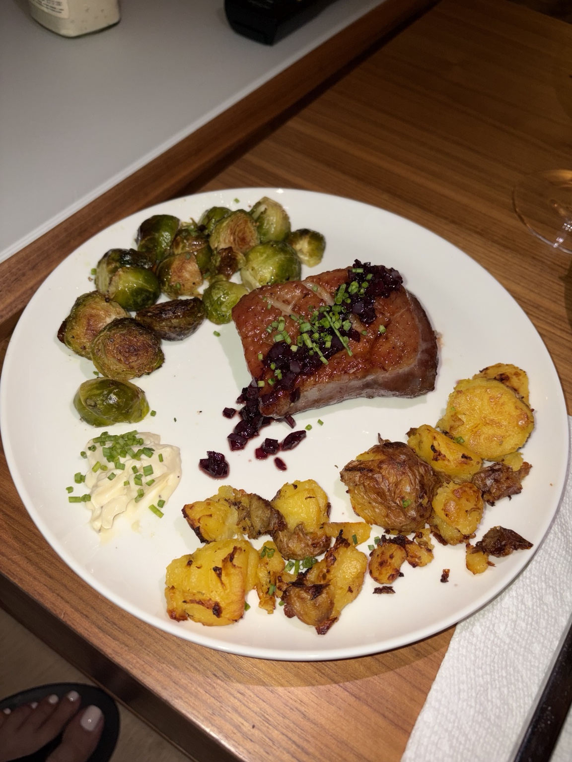 Seared duck with roasted potatoes, Brussels sprouts, fruit relish and creamy sauce