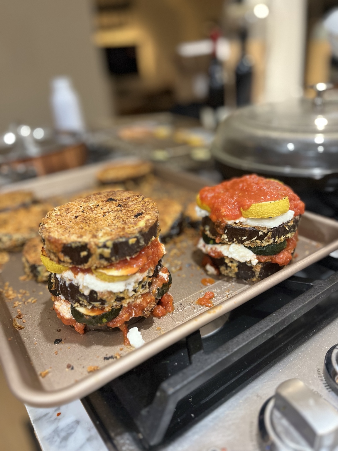 Breaded eggplant and zucchini stacks layered with cheese and tomato sauce