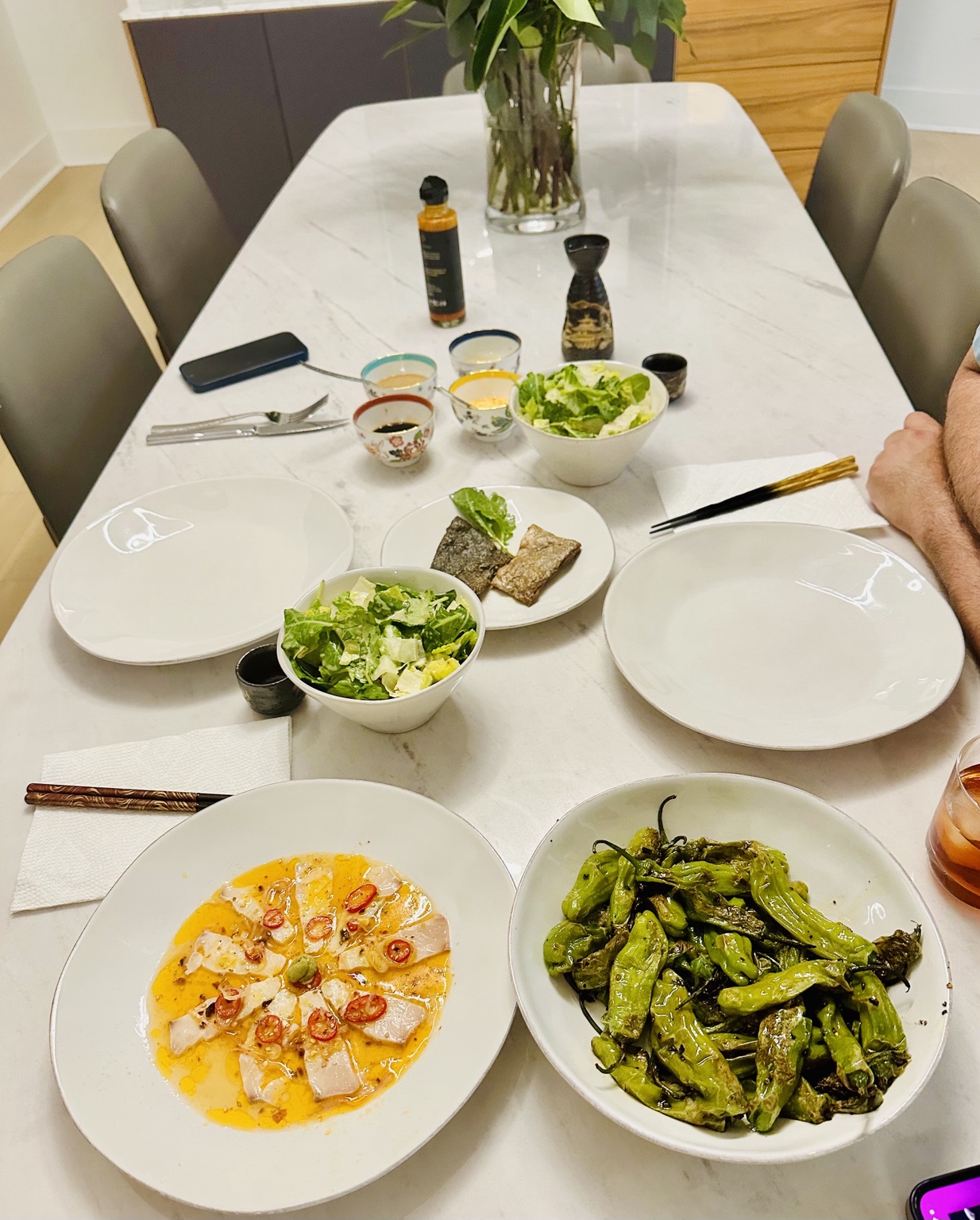 Fish crudo in a creamy chile dressing with blistered green peppers and salad