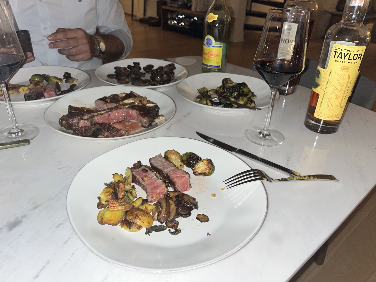 Sliced steak with sauteed mushrooms, roasted potatoes and Brussels sprouts